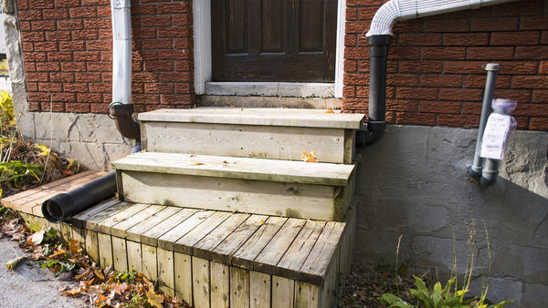 oil pipes on the outside of a house