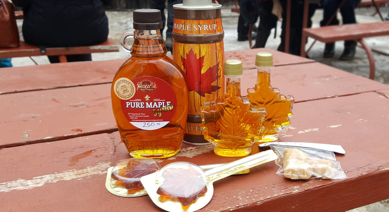 bottles of maple syrup and candy
