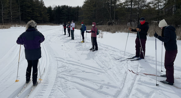 skiers in a line for a lesson